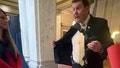 In this image taken from video, Indiana Rep. Jim Lucas, R-Seymour, flashes a holstered gun to students visiting the statehouse to talk to lawmakers about gun control, Tuesday, Jan. 30, 2024, in Indianapolis. (Makynna Fivecoats via AP)