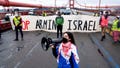 Aysha Abraibesh leads a chant while as pro-Palestinian demonstrators block commute traffic on the Golden Gate Bridge on Wednesday in San Francisco. About 20 protesters, some holding signs against Israelis military offensive in Rafah, blocked traffic in both directions for about 15 minutes.