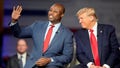 Republican presidential candidate former President Donald Trump looks to Sen. Tim Scott, R-S.C., during a Fox News Channel town hall Tuesday, Feb. 20, 2024, in Greenville, S.C. (AP Photo/Chris Carlson)