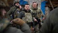 In this photo provided by the Ukrainian Presidential Press Office, Ukrainian President Volodymyr Zelenskyy, centre, during his visit to Zaporizhzhia region, the site of fierce battles with the Russian troops in Ukraine, on Feb. 4, 2024.