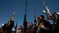 Houthi fighters stage a rally in support of the Palestinians in the Gaza Strip and against the U.S.-led airstrikes on Yemen, in Sanaa, Yemen, Monday, Jan. 29, 2024. (AP Photo/Osamah Abdulrahman)