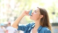 Asthmatic woman using a inhaler outdoors - Fox News