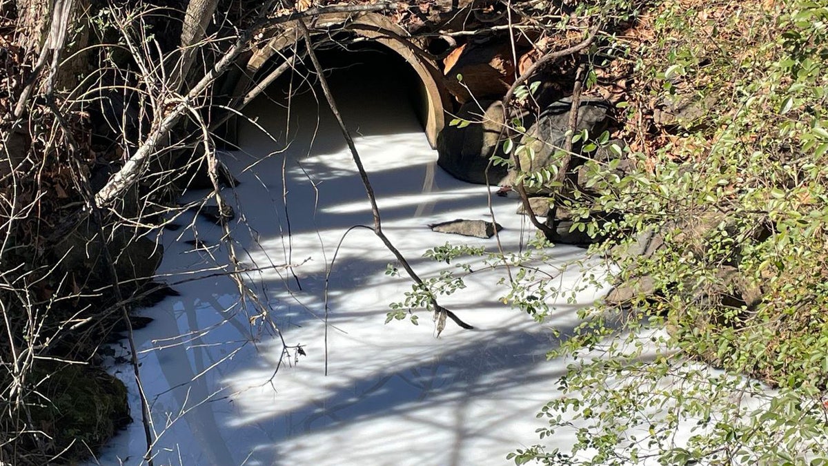 white-colored stream through pipe