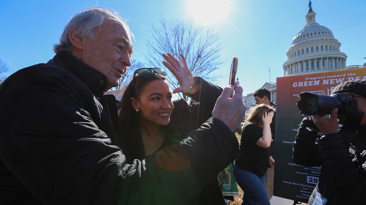 Ed Markey (L) and United States Representative Alexandria Ocasio-Cortez (2nd L) attend a press conference to celebrate the 5 year anniversary of the Green New Deal in front of the US Capitol Building in Washington DC, United States, on February 6, 2024. (Photo by Yasin Ozturk/Anadolu via Getty Images)