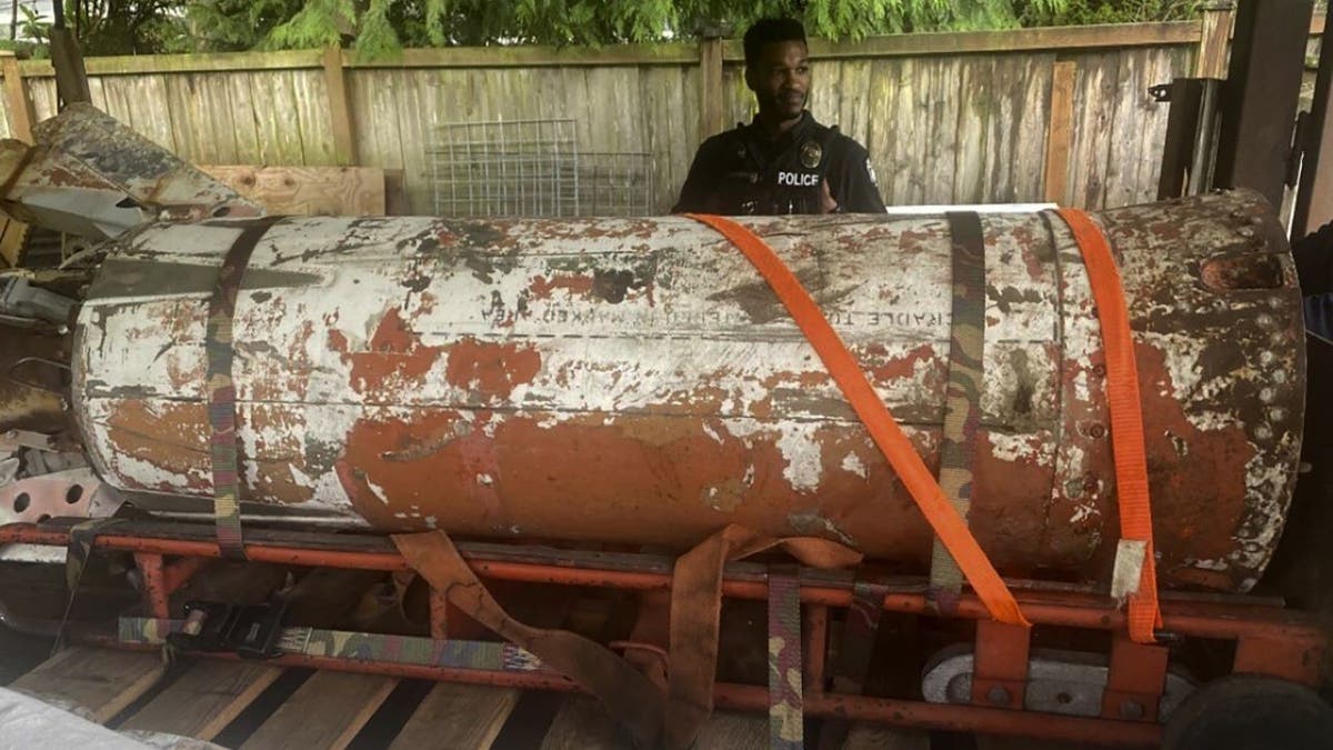 Man standing next to rocket