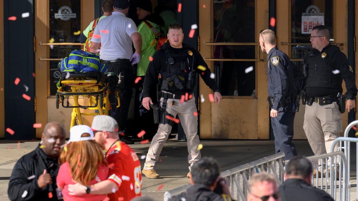 Emergency personnel, left, take a stretcher into Union Station following a shooting at the Kansas City Chiefs NFL football Super Bowl celebration in Kansas City, Mo., Wednesday, Feb. 14, 2024.