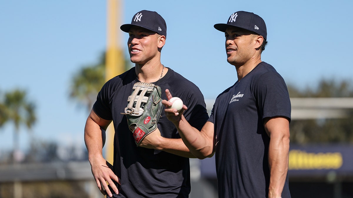 Aaron Judge and Giancarlo Stanton talk on field