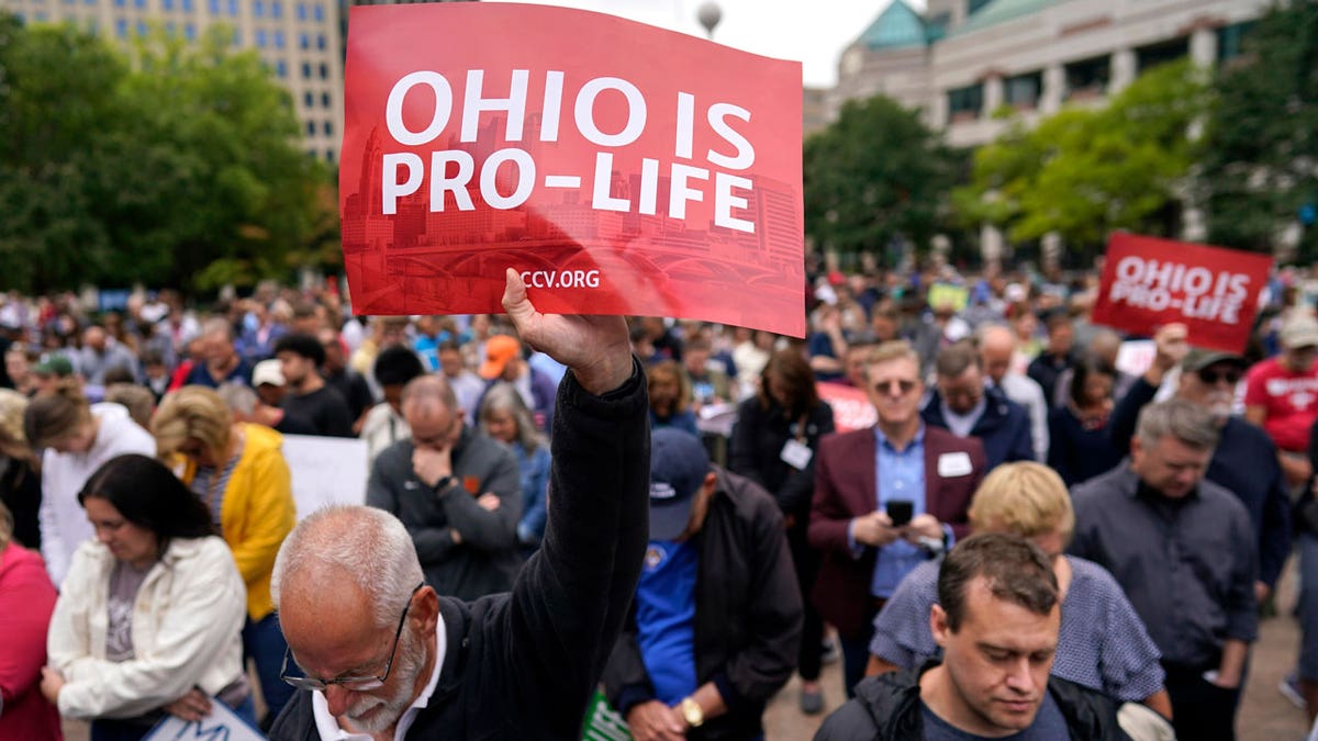 Paul Meacham holds up a sign that reads "Ohio is pro-life"