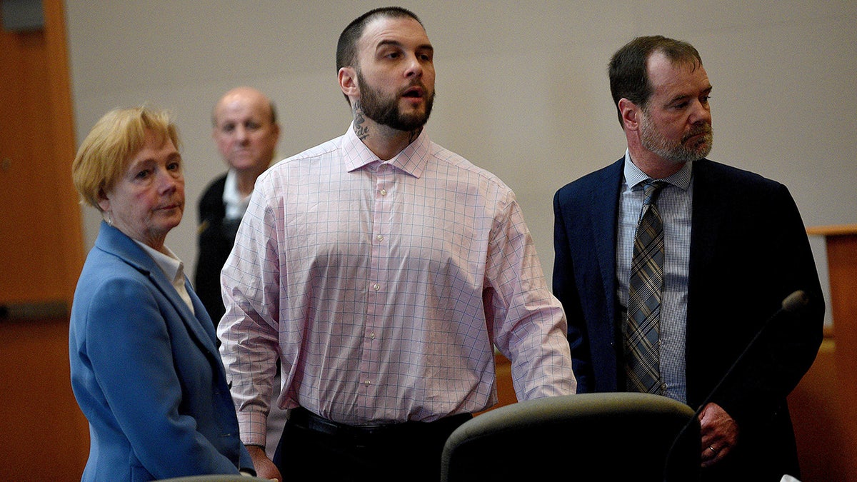 Adam Montgomery and lawyers Caroline Smith and James Brooks watching potential jurors enter courtroom