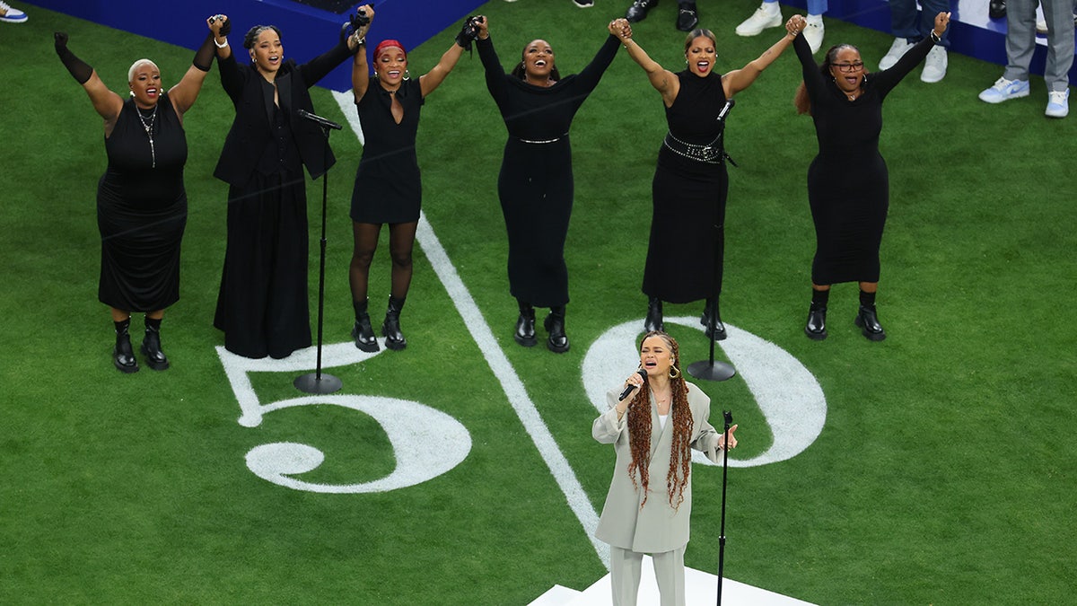 Andra Day and singers