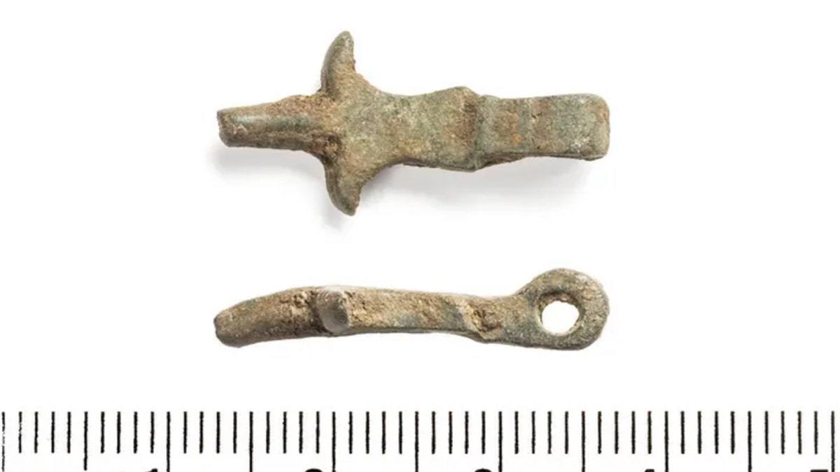 Belt buckle and horse harness fragment.