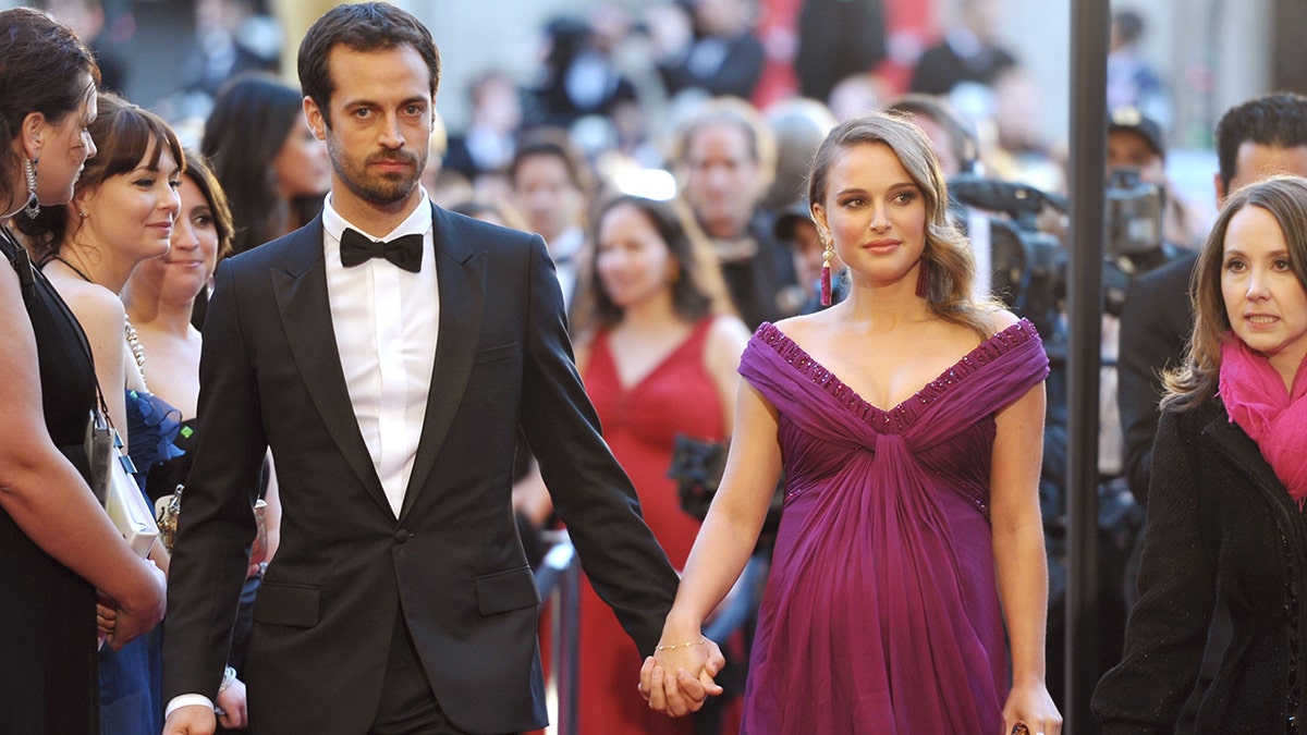 Benjamin Millepied and Natalie Portman hold hands on red carpet
