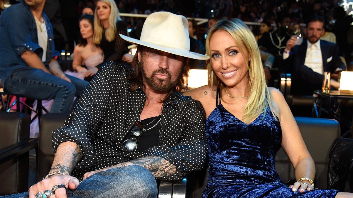 Billy Ray Cyrus and Tish Cyrus sitting together