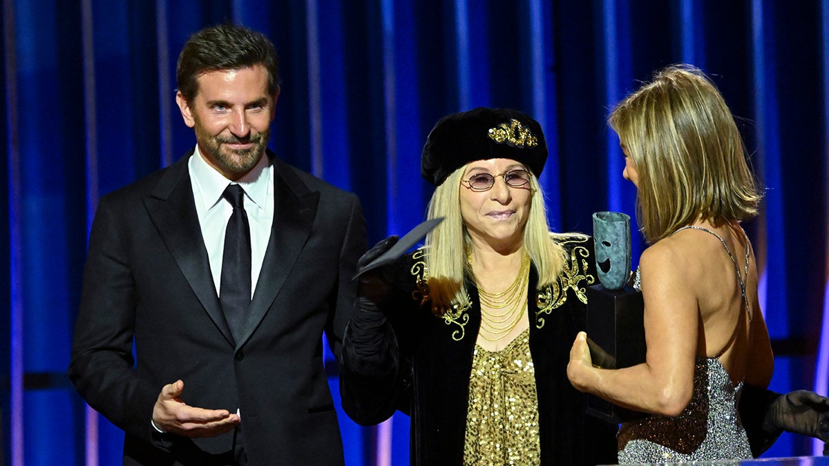 Bradley Cooper on stage with Barbra Streisand and Jennifer Aniston