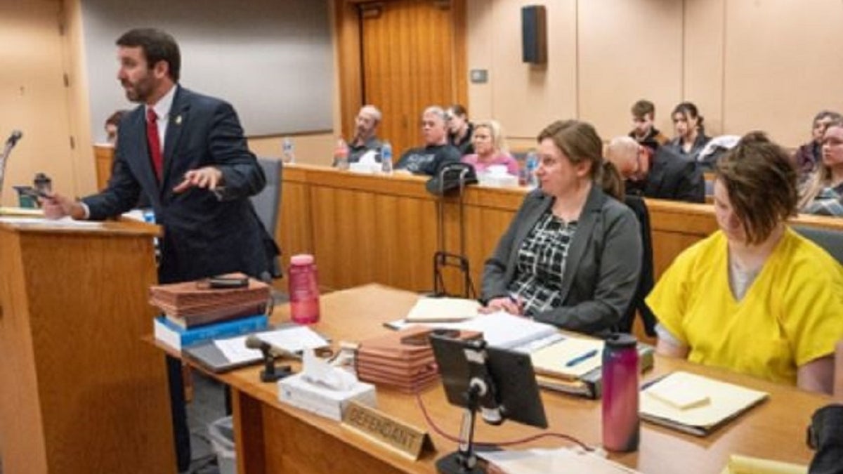 Denali Brehmer sits in a courtroom