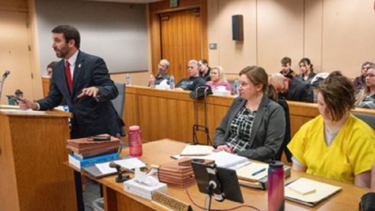 Denali Brehmer sits in a courtroom