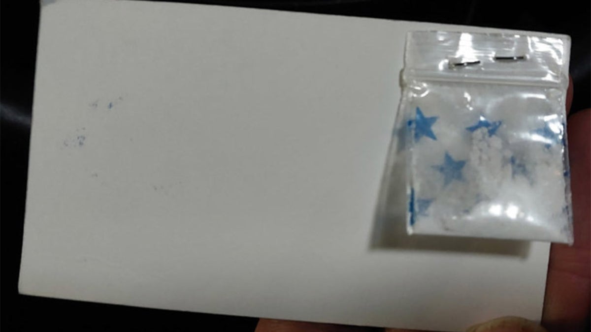 Man arrested for peddling business cards with free cocaine samples stapled on