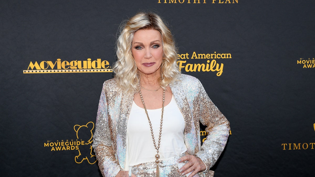 Donna Mills posing on the red carpet