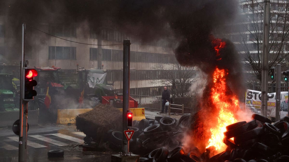 Smoke rises from burning tires