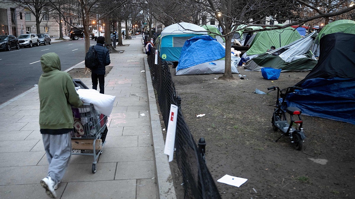 Tents, people walking
