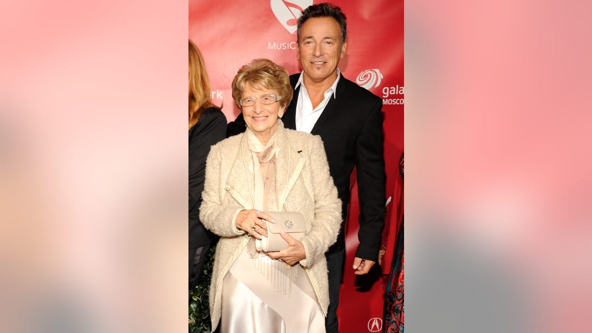 bruce springsteen on a red carpet with his mom adele
