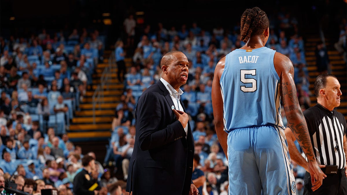 Hubert Davis speaks with Armando Bacot