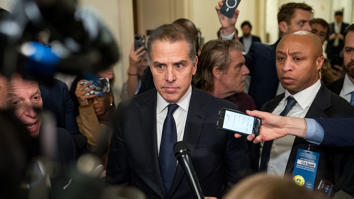 Hunter Biden surrounded by reporters on Capitol Hill