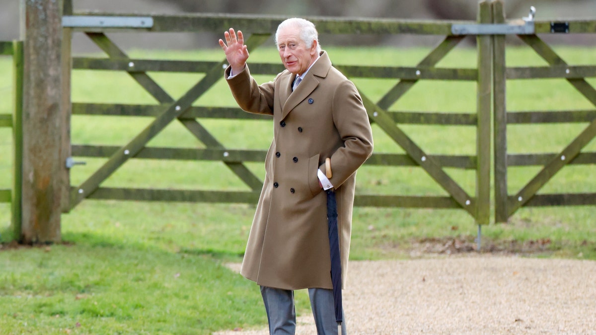 king charles waving while walking at sandringham house 