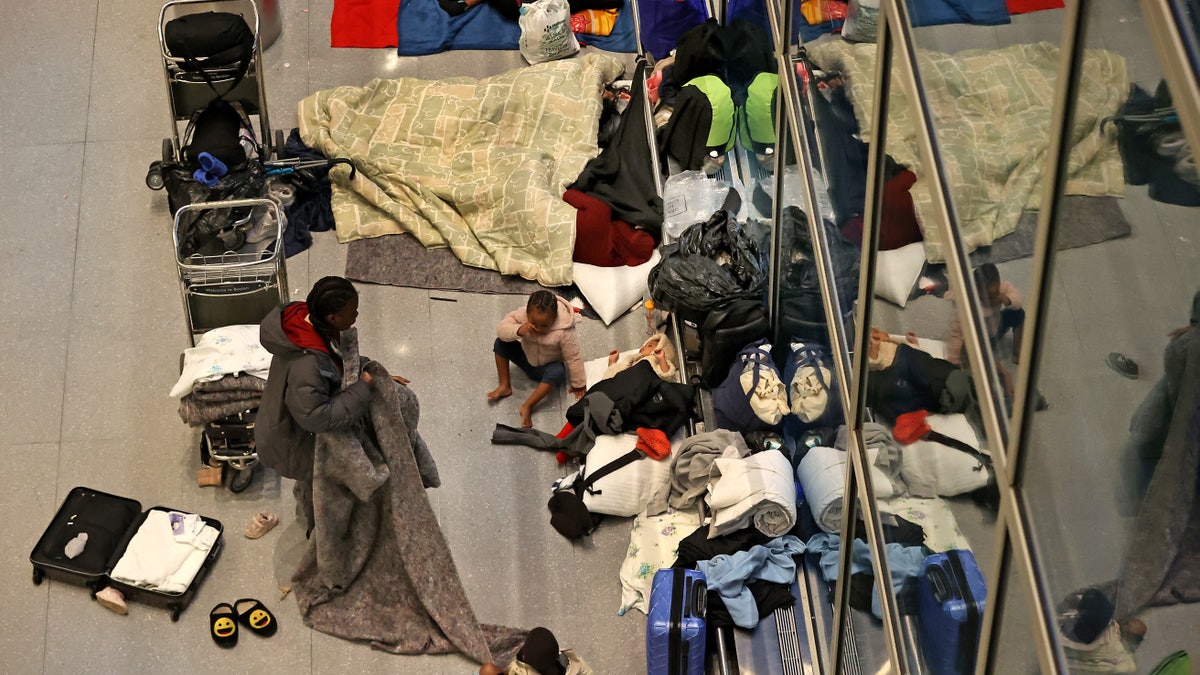 Migrants sleep at Boston airport