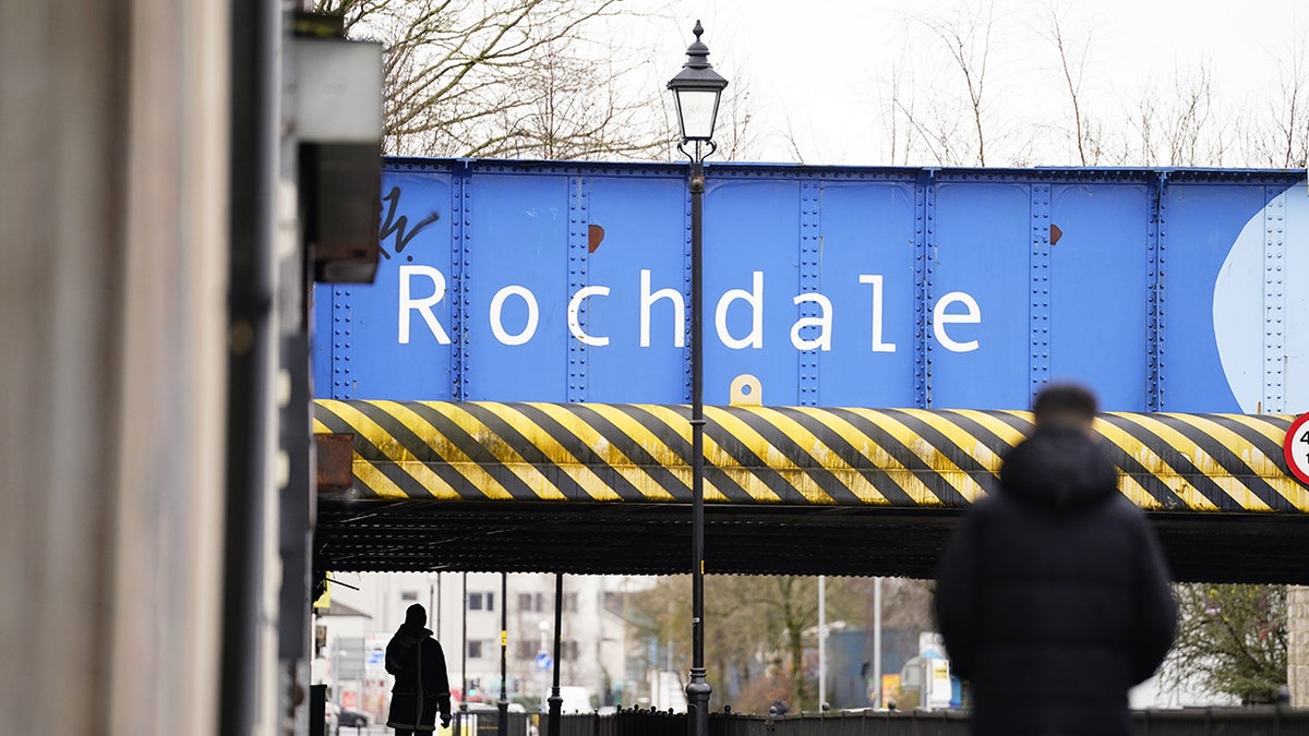 Rochdale overpass as residents walk on the street