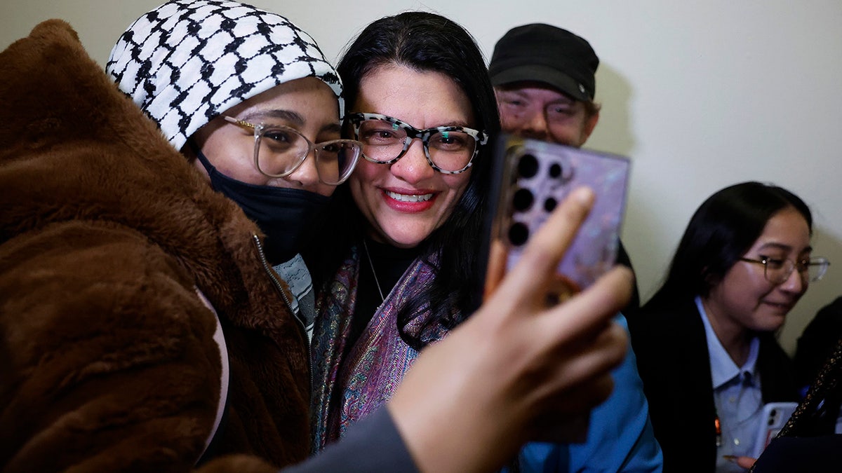 Tlaib takes a selfie with a pro-Palestine protester