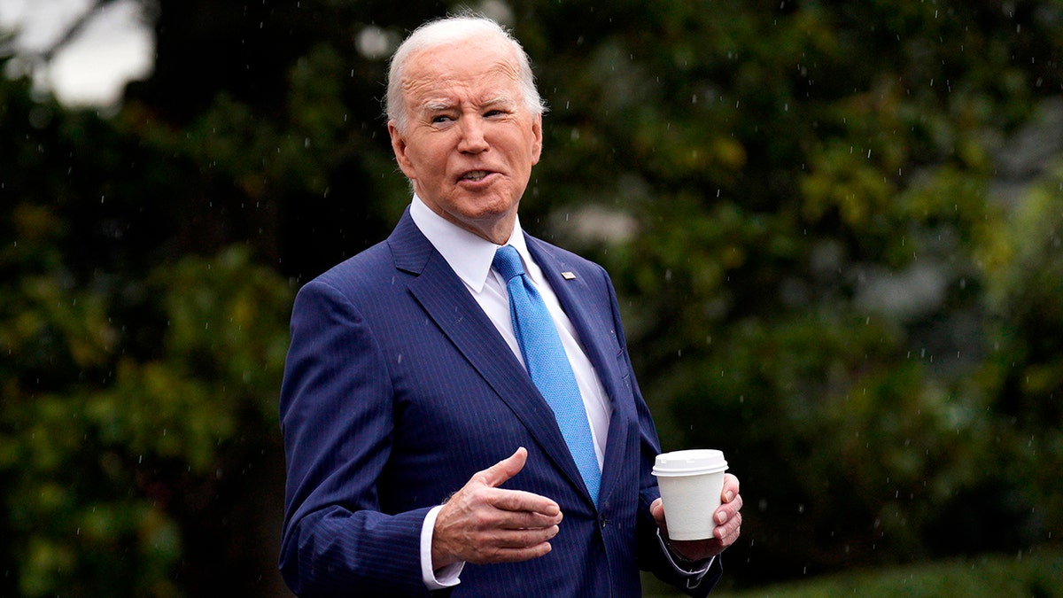 Biden holding coffee