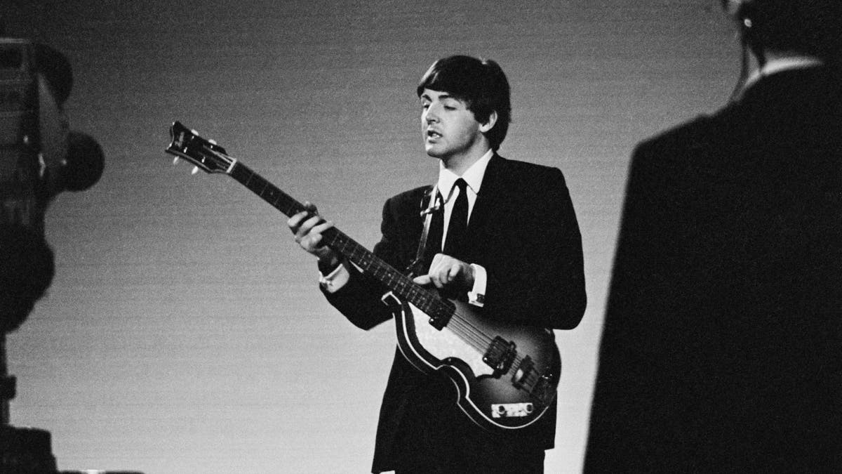Paul McCartney playing guitar 1963.