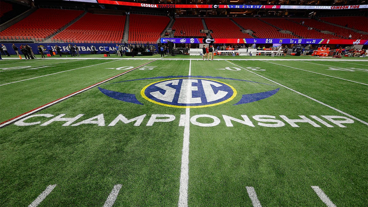 The SEC logo on the football field