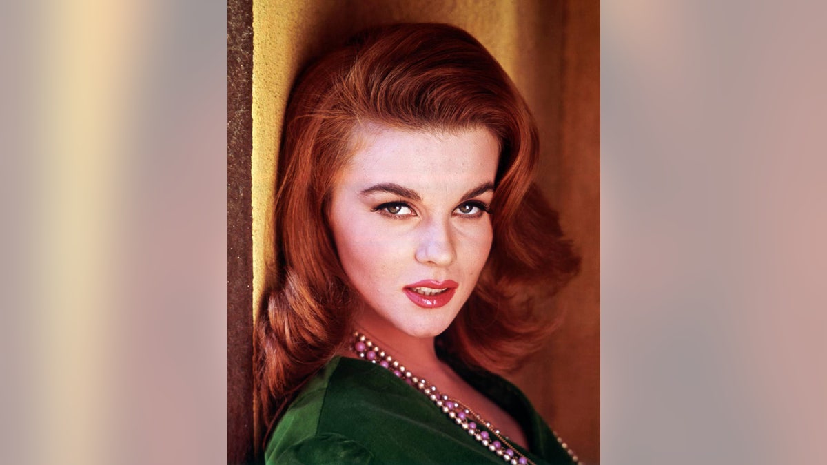 A close-up of Ann-Margret wearing a green blouse
