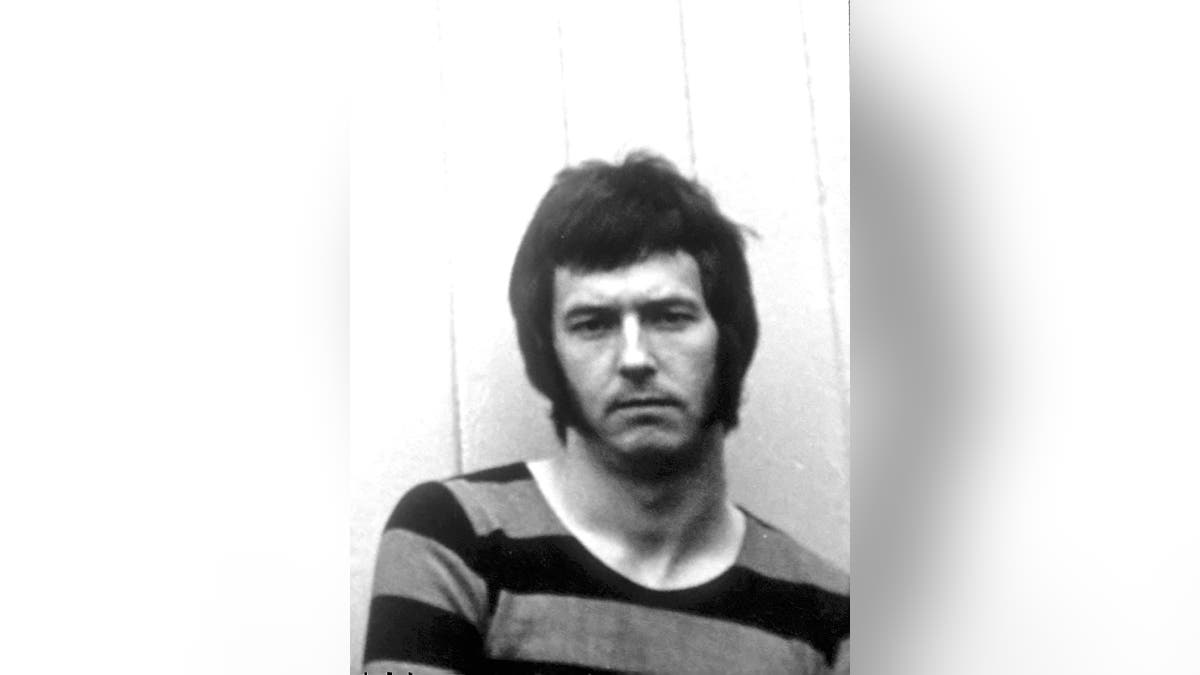 Eric Clapton wearing a striped sweater