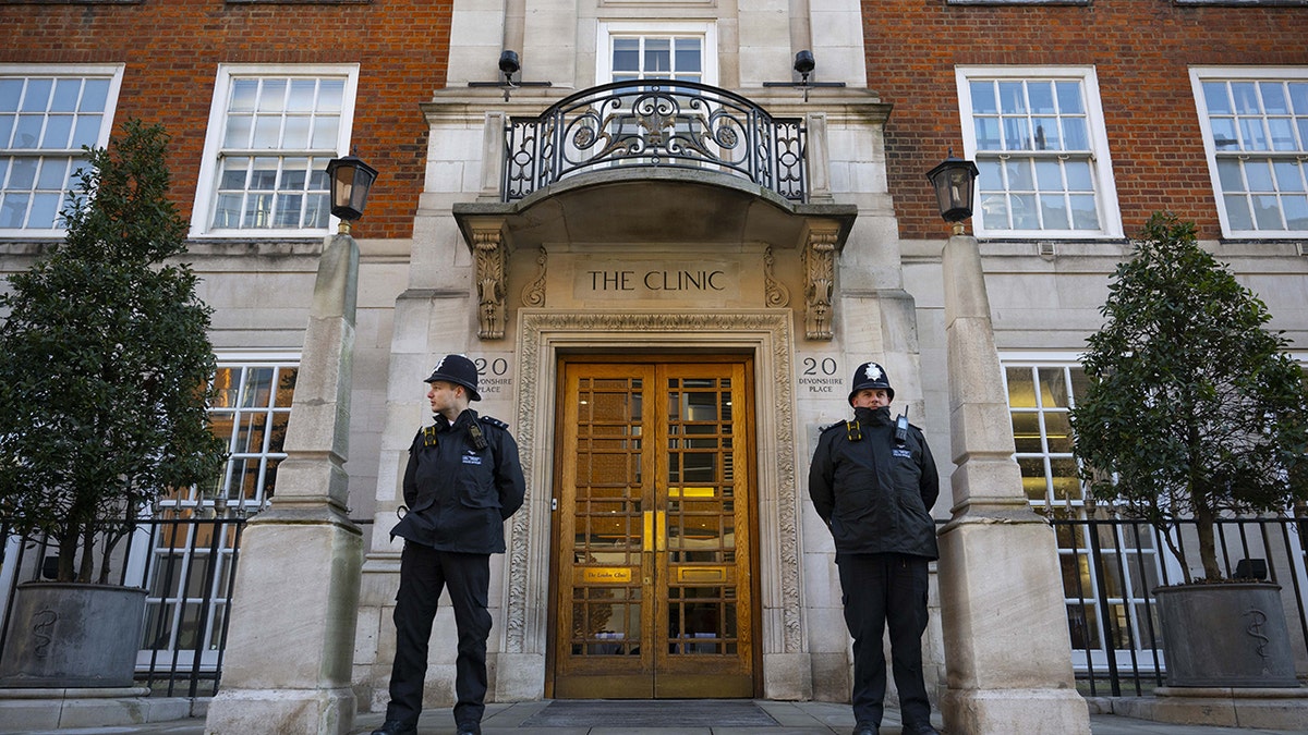 Police officers standing in front of a London hospital