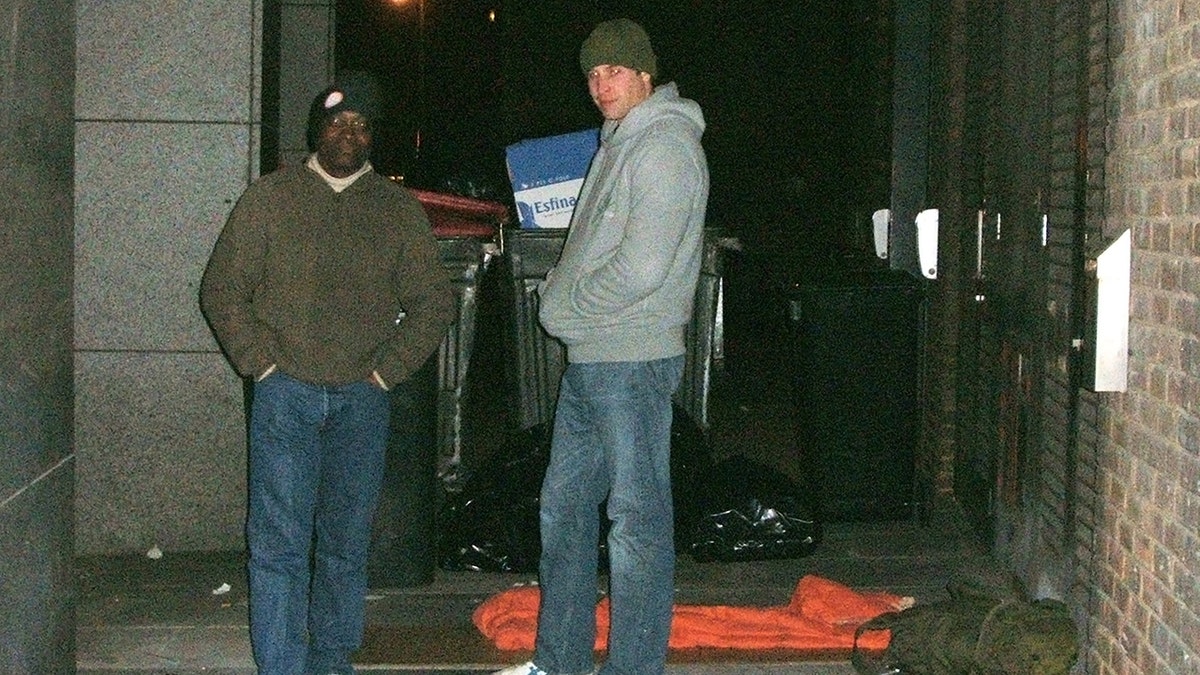 Prince William outside on the streets of London at night