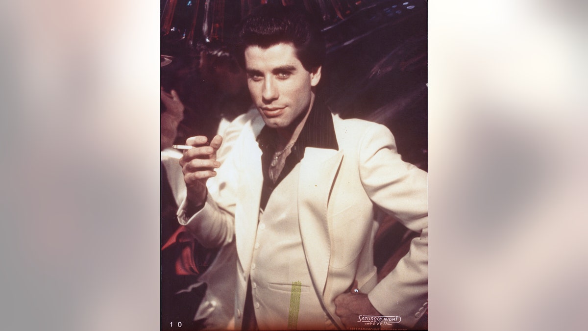 John Travolta in costume for a scene of Saturday Night Fever