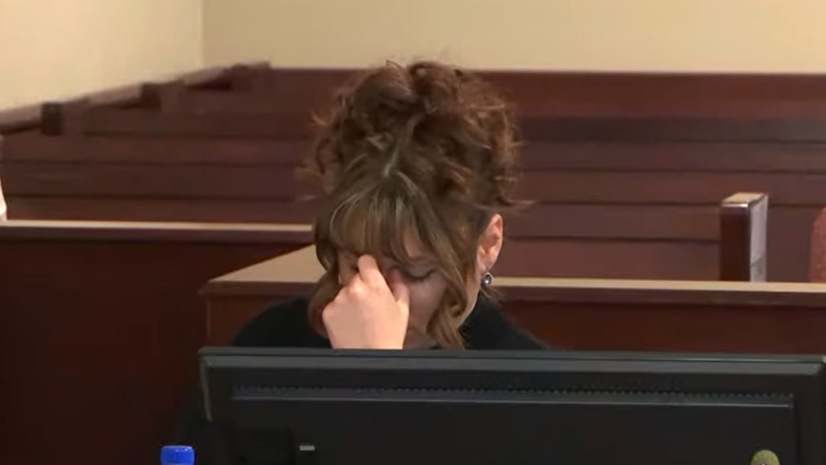 Hannah Gutierrez Reed looks down in court