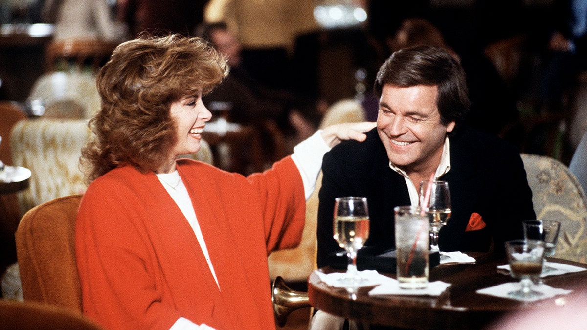 Stefanie Powers and Robert Wagner laughing on the set of Hart to Hart