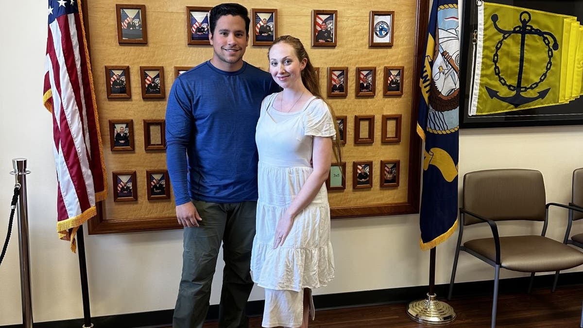Roger and Ashleigh standing in Navy office