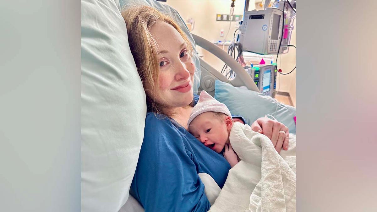 Ashleigh holding Lyla in delivery room