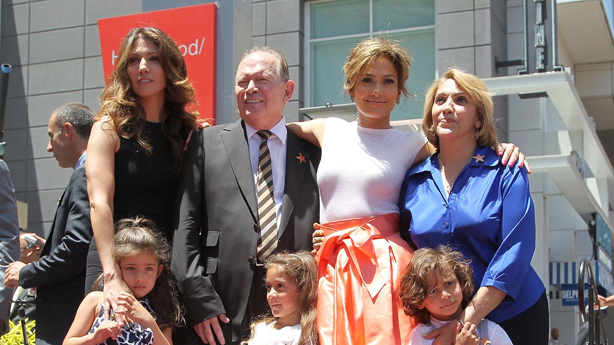 Lynda Lopez, father David Lopez, Jennifer Lopez, mother Guadalupe Lopez, daughter Emme Maribel (front L) and son Maximilian David posing together