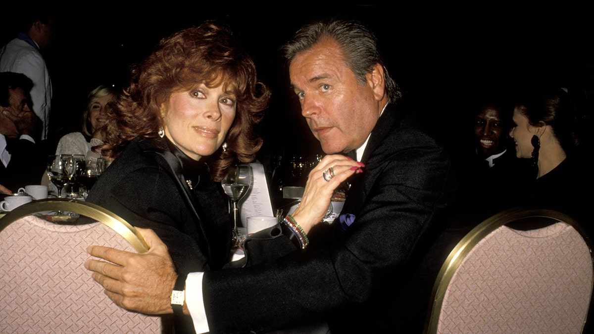 Jill St. John and Robert Wagner sitting at a table together