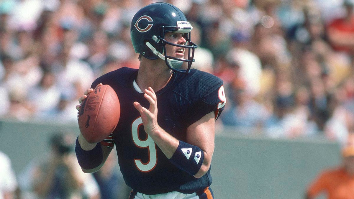 Jim McMahon drops back to pass