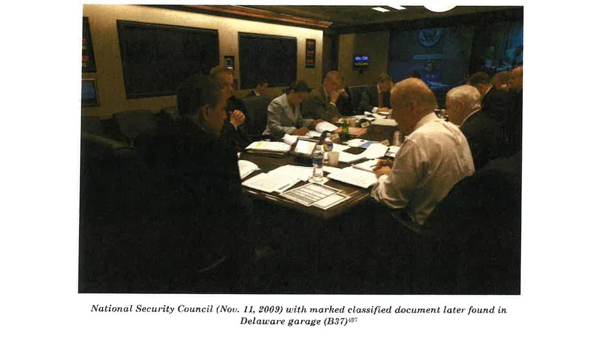 This image from Special Council Robert Hur’s investigation released by the Department of Justice on Thursday, February 8, 2024 shows Joe Biden attending a National Security Council meeting with a classified document that was later found in his Delaware garage.