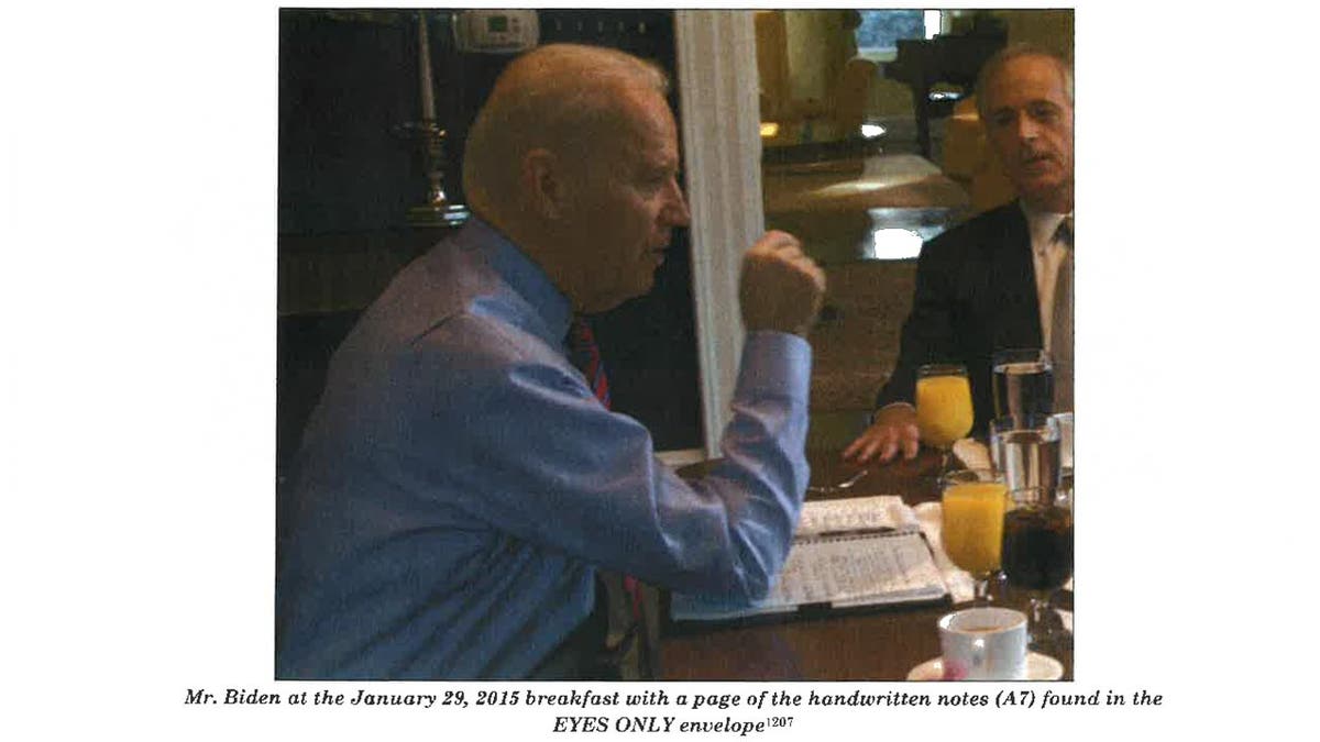 This image from Special Council Robert Hur’s investigation released by the Department of Justice on Thursday, February 8, 2024 shows Joe Biden with a page of handwritten notes while eating breakfast alongside senators on January 29, 2015.