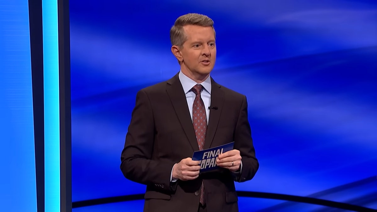 Ken Jennings standing on the "Jeopardy!" stage