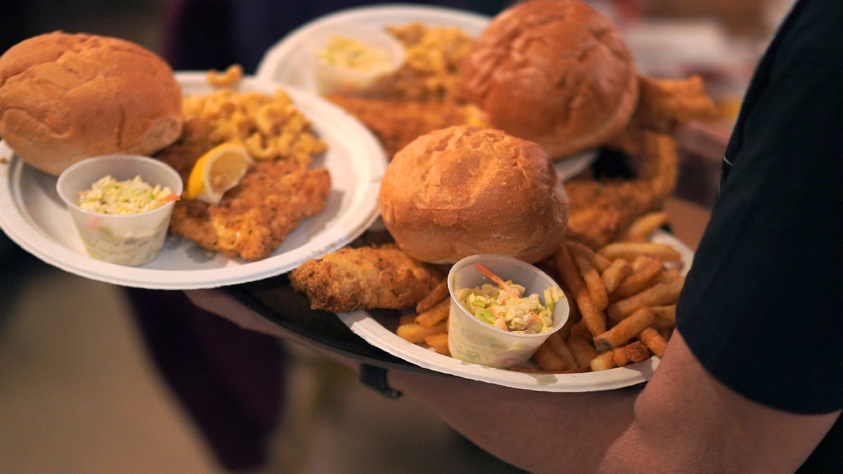 Plate of food at a fish fry including fries and coleslaw